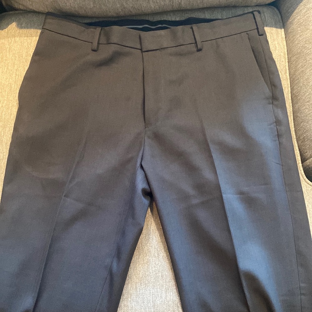 Dark gray men’s Van Heusen dress pants.